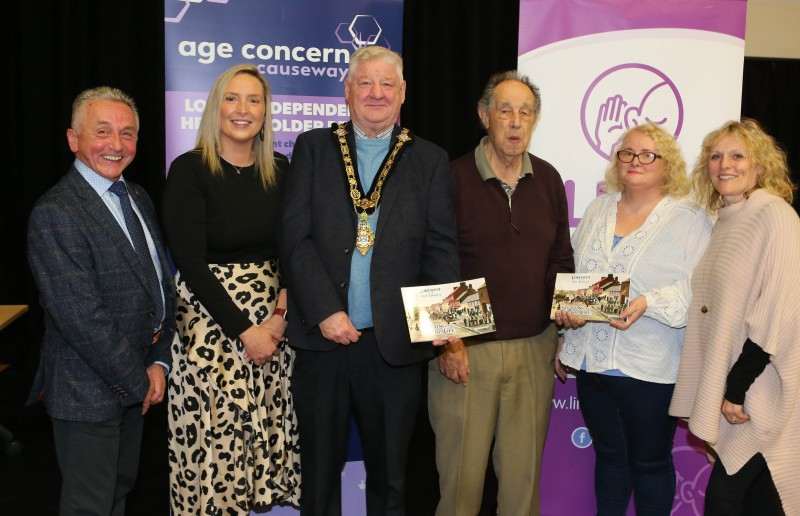 Mayor of Causeway Coast and Glens, Councillor Steven Callaghan and Nelson McGonagle with representatives from the two charities that will benefit from the new book, Age Concern Causeway and Limavady Initiative for the Prevention of Suicide (LIPS)