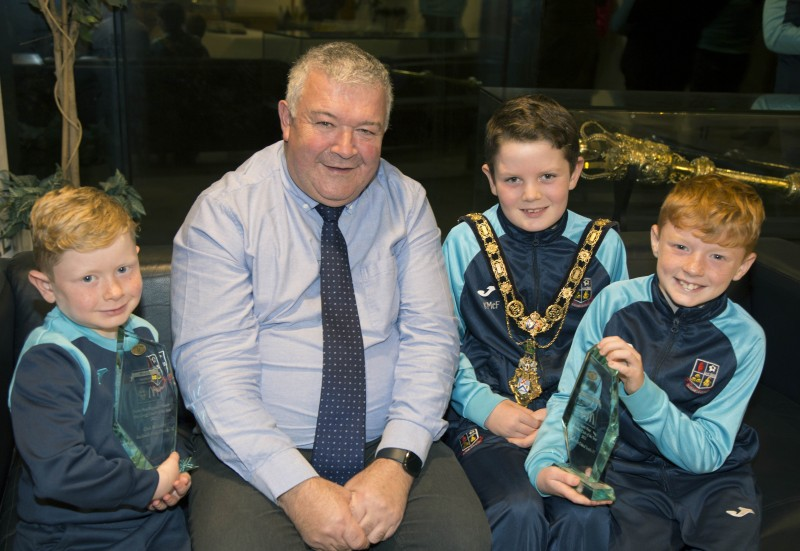 The Mayor of Causeway Coast and Glens Borough Council, Councillor Ivor Wallace, pictured with Oliver McKendry, Leo McKendry and Kyle McFarland, Bushmills United Youths members, at the special reception held recently in Cloonavin.
