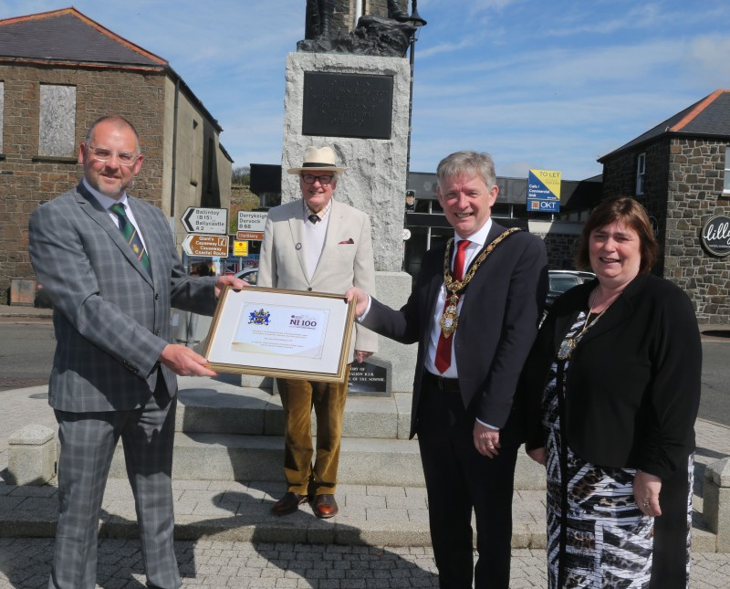 Mark Heaney, Chairman of the Bushmills branch of the Royal British Legion and Jim Fairbairn, Branch President, receive a framed centenary certificate from the Mayor of Causeway Coast and Glens Borough Council Alderman Mark Fielding and Mayoress Mrs Phyliss Fielding
