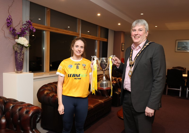 Pictured at a reception in Cloonavin is the Mayor of Causeway Coast and Glens Borough Council, Councillor Richard Holmes,with the Intermediate Antrim Camogie team captain, Lucia McNaughton from Loughgiel.