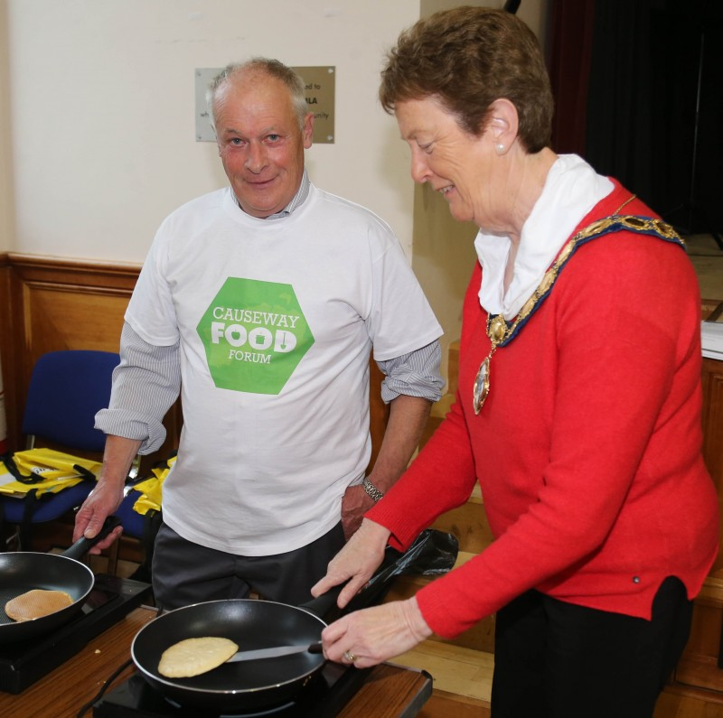 The Mayor of Causeway Coast and Glens Borough Council, Councillor Joan Baird OBE, pictured flipping some pancakes with Paul Corrigan from Greenlight at the Causeway Food Forum event in Coleraine Town Hall.