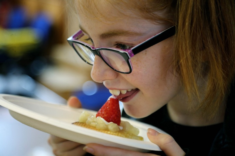 Eden Branter pictured enjoying her pancakes with fruit at the event in Coleraine Town Hall.