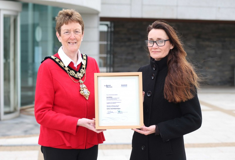 The Mayor of Causeway Coast and Glens Borough Council Councillor Joan Baird OBE presents Nina McNeary with her Marsh award certificate from the British Museum.