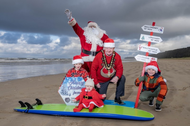 Florence Adair (1), Fraser Caithness (9) and Hugo Caithness (6) pictured with the Mayor, Councillor Steven Callaghan and Santa at Benone beach for the launch of the Christmas events programme.