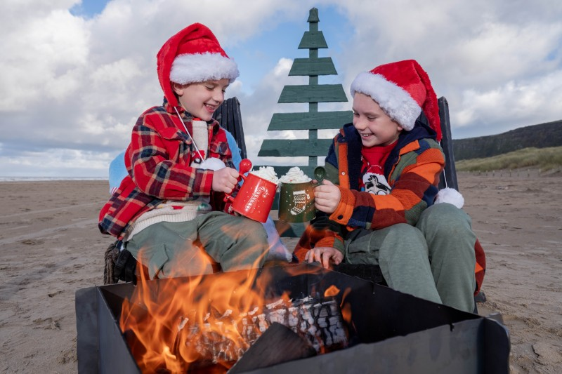 Fraser Caithness (9) and Hugo Caithness (6) enjoying a warm hot chocolate at Benone beach as they look forward to Council’s upcoming Christmas events.