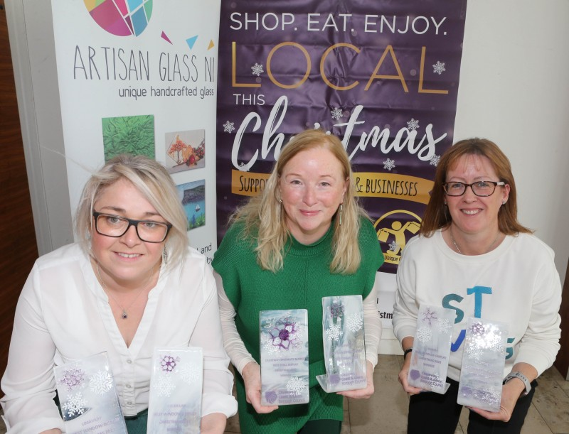 Denise Loughrey of Artisan Glass NI, Geraldine Wills (left) and Catrina McNeill, Council’s Town and Village Management officers, launch this year’s Christmas window display competition.
