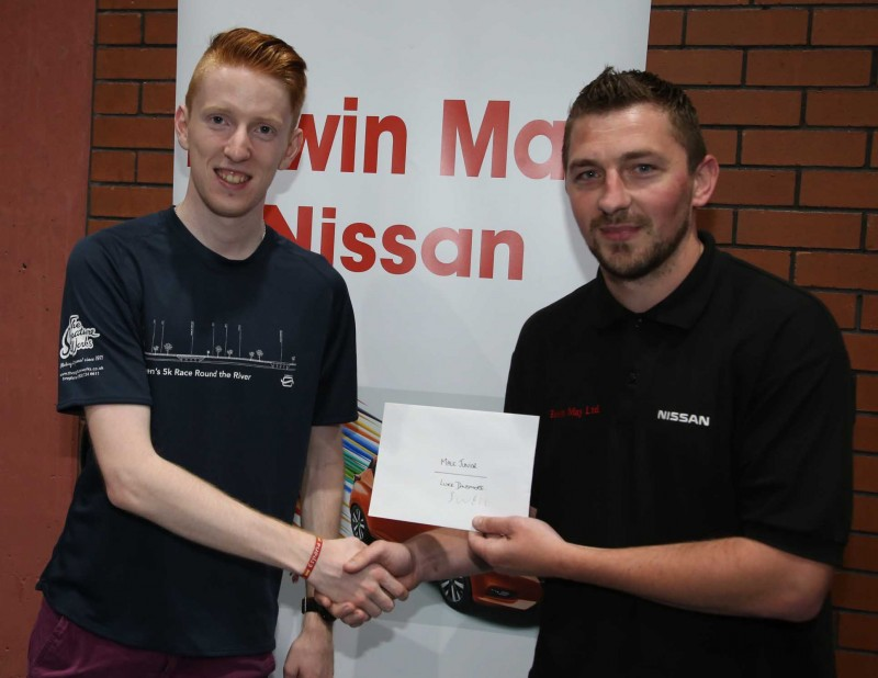 Male Junior winner Luke Dinsmore receives his prize from Aaron Watton representing Edwin May Nissan.