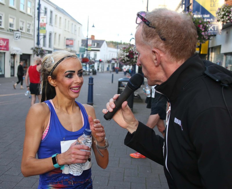 The first lady across the finish line Amy Bulman is congratulated by Peter Jack.