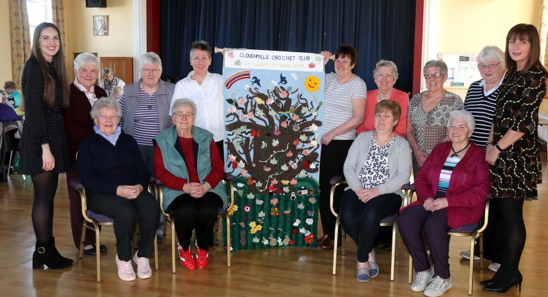 Members of Cloughmills Crochet Group pictured with Amy McWilliams and Patricia Harkin from Causeway Coast and Glens Borough Council’s Good Relations Team along with the piece of art created by the group to depict shared space.