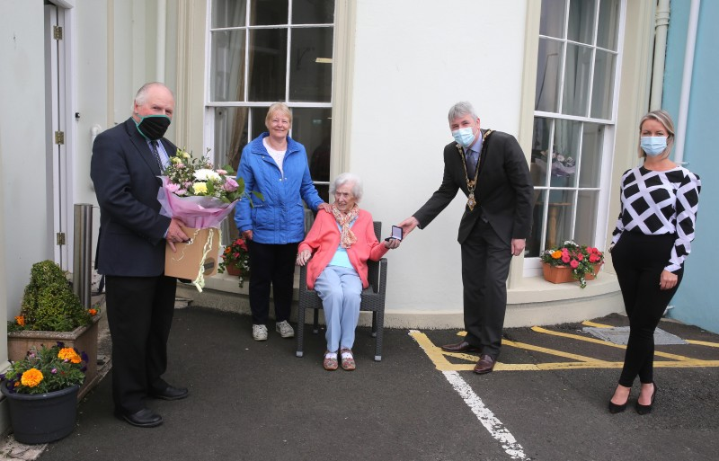 Centenary coin recipient Elizabeth MacRory receives her presentation from the Mayor of Causeway Coast and Glens Borough Council Councillor Richard Holmes along with her friend Jean Burgess and Amanda Duncan (Manager at Seabank Residential Home in Portrush).
