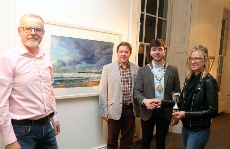 The Mayor of Causeway Coast and Glens Borough Council Councillor Sean Bateson pictured at the 71st exhibition launch of Coleraine Art Society at Flowerfield Arts Centre with Kevin McClelland, Coleraine Art Society Chairperson, Raymond Kennedy, Guest Judge and Sarah Carrington, award winner for her painting ‘Dark Sky, Runkerry.’