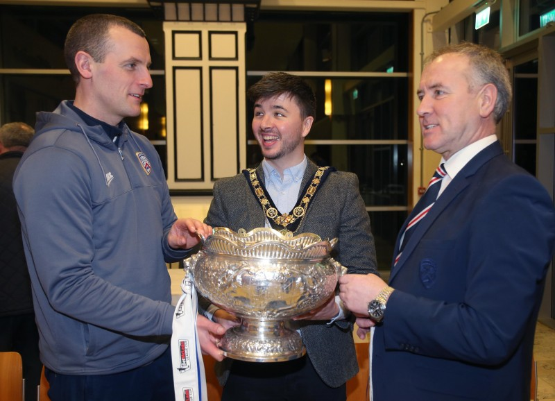 Manager Oran Kearney (Left) and Chairman Colin McKendry (Right) pictured with the League Cup and the Mayor of Causeway Coast and Glens Borough Council Councillor Sean Bateson at a recent reception held in Cloonavin.