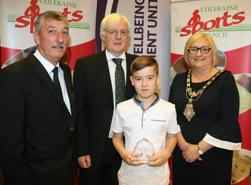 Reece McCloskey, Junior Sportsman of the Year, receives his award from the Mayor of Causeway Coast and Glens Borough Council Councillor Brenda Chivers, John Church, Chair Coleraine Sports Council and Robert McVeigh from Northern Ireland Commonwealth Games Council. Reece is the current Shotokan Karate Irish Champion (third year in a row) and won first place at the British National Championships Boys Kumite and the Prestigious Liverpool Youth Championships.