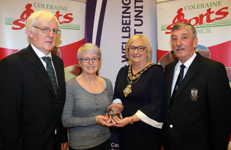 Hockey player Ursula Harper receives her award for Services to Sports from the Mayor of Causeway Coast and Glens Borough Council Councillor Brenda Chivers with Robert McVeigh from Northern Ireland Commonwealth Games Council and John Church, Chair Coleraine Sports Council.