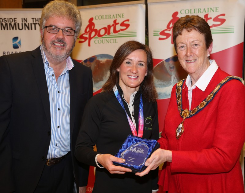 Ursula Goode from Sika Gymanastics Club accepts her Sportswoman of the Year award from the Mayor of Causeway Coast and Glens Borough Council Councillor Joan Baird OBE and Grant Cameron, BBC Sport Northern Ireland.