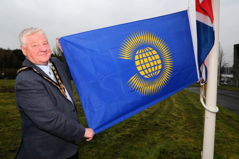 The Mayor of Causeway Coast and Glens, Councillor Steven Callaghan raises the Commonwealth flag at Cloonavin to mark Commonwealth Day 2024.