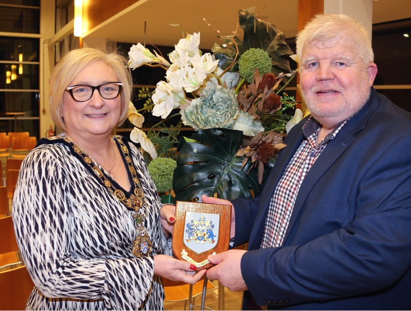 The Mayor of Causeway Coast and Glens Borough Council, Councillor Brenda Chivers pictured with Community Rescue Service Regional Commander, Sean Mc Carry as he receives the Causeway Coast and Glens Borough Council Coat of Arms at a civic reception in Cloonavin.