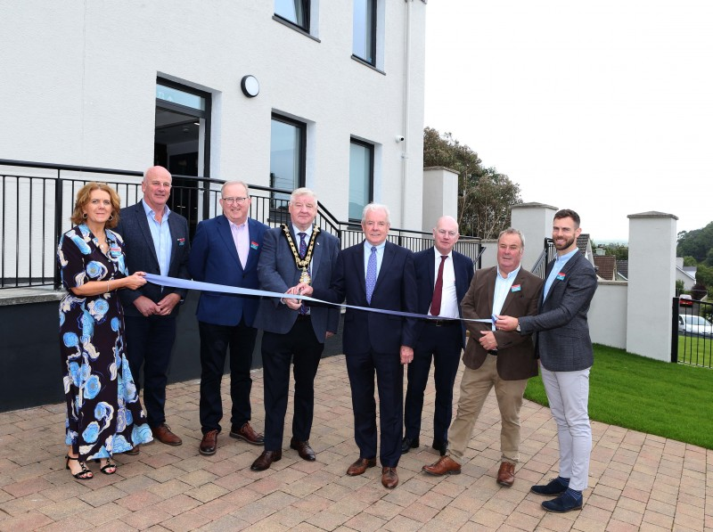 Mayor of Causeway Coast and Glens, Councillor Steven Callaghan cuts the ribbon to officially open the new Cushendall Innovation Centre. Also pictured are Grow the Glens directors Mary McAllister, Paddy McLaughlin, Eddie McGoldrick, Liam O’Hagan, Paul McAllister, Andrew McAllister and Neil McManus.
