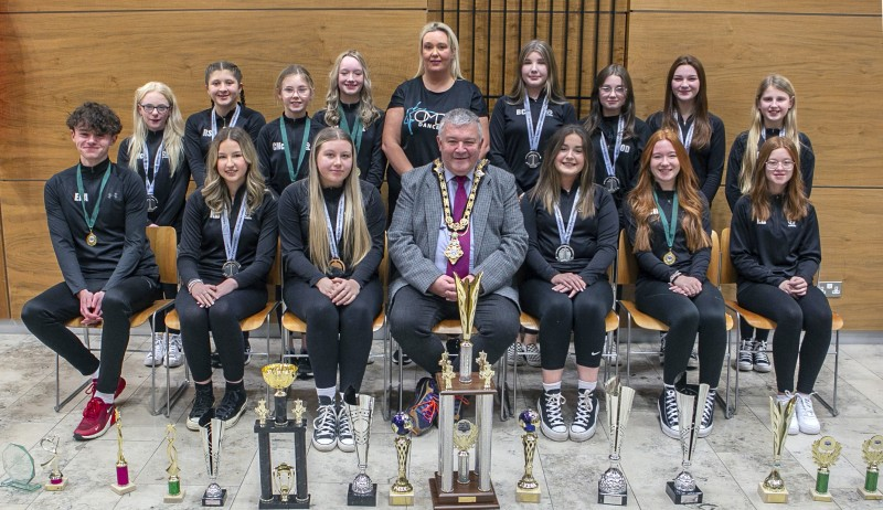 Members of OMD Dance and their dance instructor Orla Dixon pictured with some of their trophies in Cloonavin with the Mayor of Causeway Coast and Glens Borough Council, Councillor Ivor Wallace.