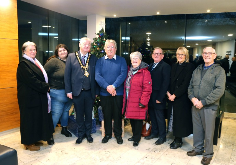 The Mayor of Causeway Coast and Glens, Councillor Steven Callaghan pictured alongside local photographer Derek McIntyre and his family who attended a recent reception in Council’s Civic Headquarters.