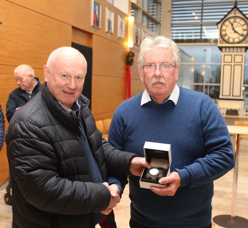 Local photographer Derek McIntyre who was recognised at a recent Mayors reception, pictured here with Mervyn White as he is presented with a gift.