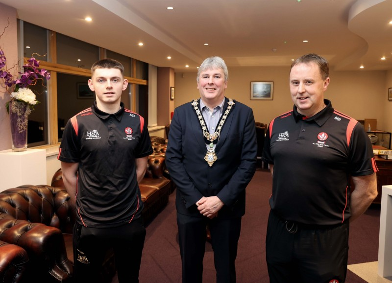 The Mayor of Causeway Coast and Glens Borough Council Councillor Richard Holmes pictured with team captain Matthew Downey and manager Martin Boyle in the Mayor’s Parlour in Cloonavin during a reception for Derry’s All-Ireland winning minor football team.