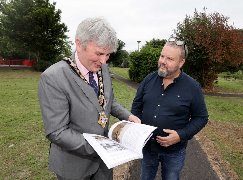 The Mayor of Causeway Coast and Glens Borough Council Councillor Richard Holmes looks through a copy of Dervock & District Community Association’s recently produced book ‘The Parish of Derrykeighan – A Rammel Through North Antrim: The Who, The What, The Where’ made possible by Causeway Coast and Glens Borough Council’s £3.8m Local Area Action Plan, funded by the European Union’s PEACE IV Programme, managed by the Special EU Programmes Body (SEUPB).