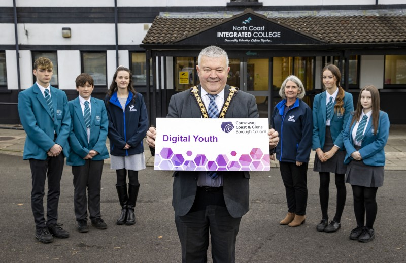 The Mayor of Causeway Coast and Glens Borough Council, Councillor Ivor Wallace, pictured at the launch of the Digital Schools programme with pupils from North Coast Integrated College in Coleraine and Sharon Barrett and Jane Hanna, Area Managers with entrepreneurship charity Young Enterprise.