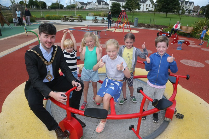 The Mayor of Causeway Coast and Glens Borough Council Councillor Sean Bateson tries out some of the inclusive play equipment at the Diversity Park in Portstewart.