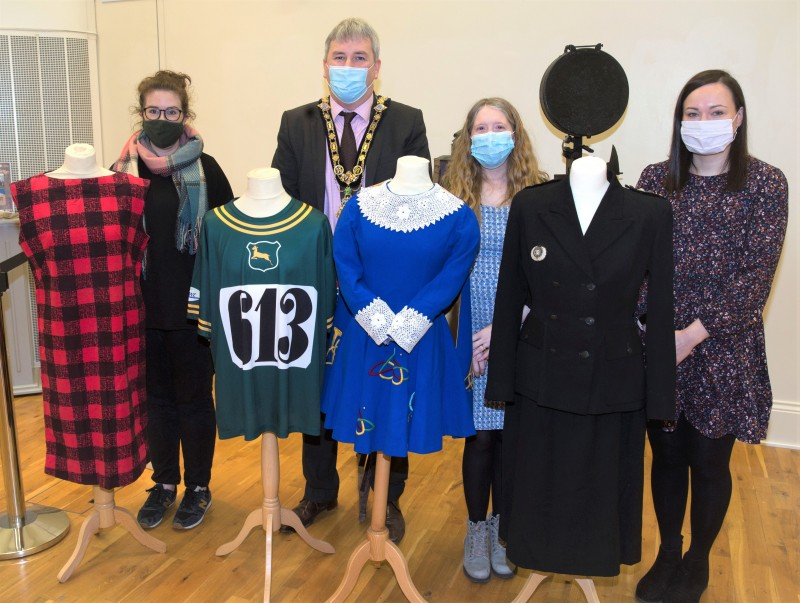 Rachel Archibald, Jamie Austin and Sarah Carson from Causeway Coast and Glens Borough Council’s Museums Service and the Mayor, Councillor Richard Holmes, view some of the fashion and costume items on display in the ‘100 Objects for 100 Years’ exhibition currently open at Ballymoney Museum.