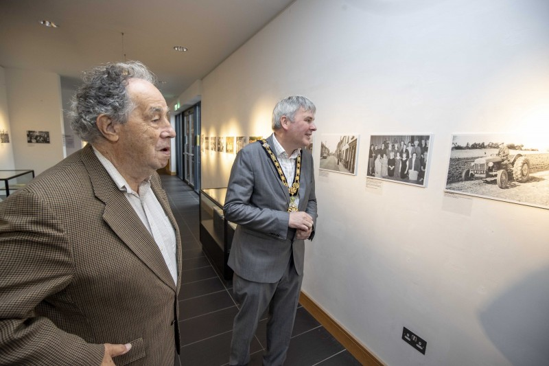 The Mayor of Causeway Coast and Glens Borough Council Councillor Richard Holmes enjoys a tour of the exhibition with local historian Nelson McGonagle.