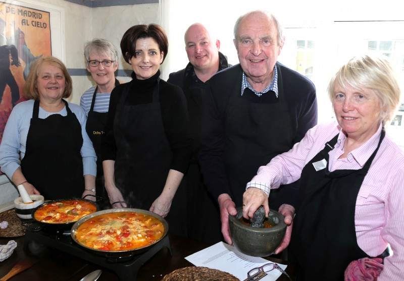Some of the tourism trade participants who took part in the familiarisation trip organised by Causeway Coast and Glens Borough Council pictured with their cooked paella at Ocho Tapas in Portrush.