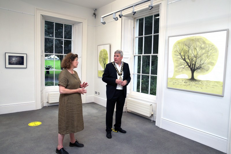 Katie English pictured at Flowerfield Arts Centre where her new exhibition is on display with the Mayor of Causeway Coast and Glens Borough Council Councillor Richard Holmes