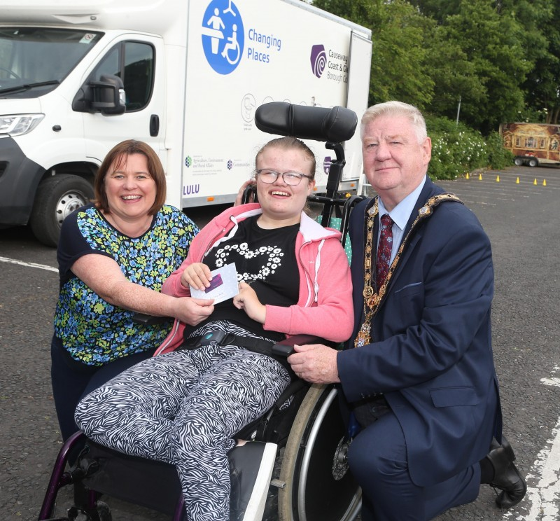 Christine McClements, with daughter Lilia receiving a £50 Causeway Coast and Glens gift card from the Mayor, Councillor Steven Callaghan for naming unit Lili-Loo.