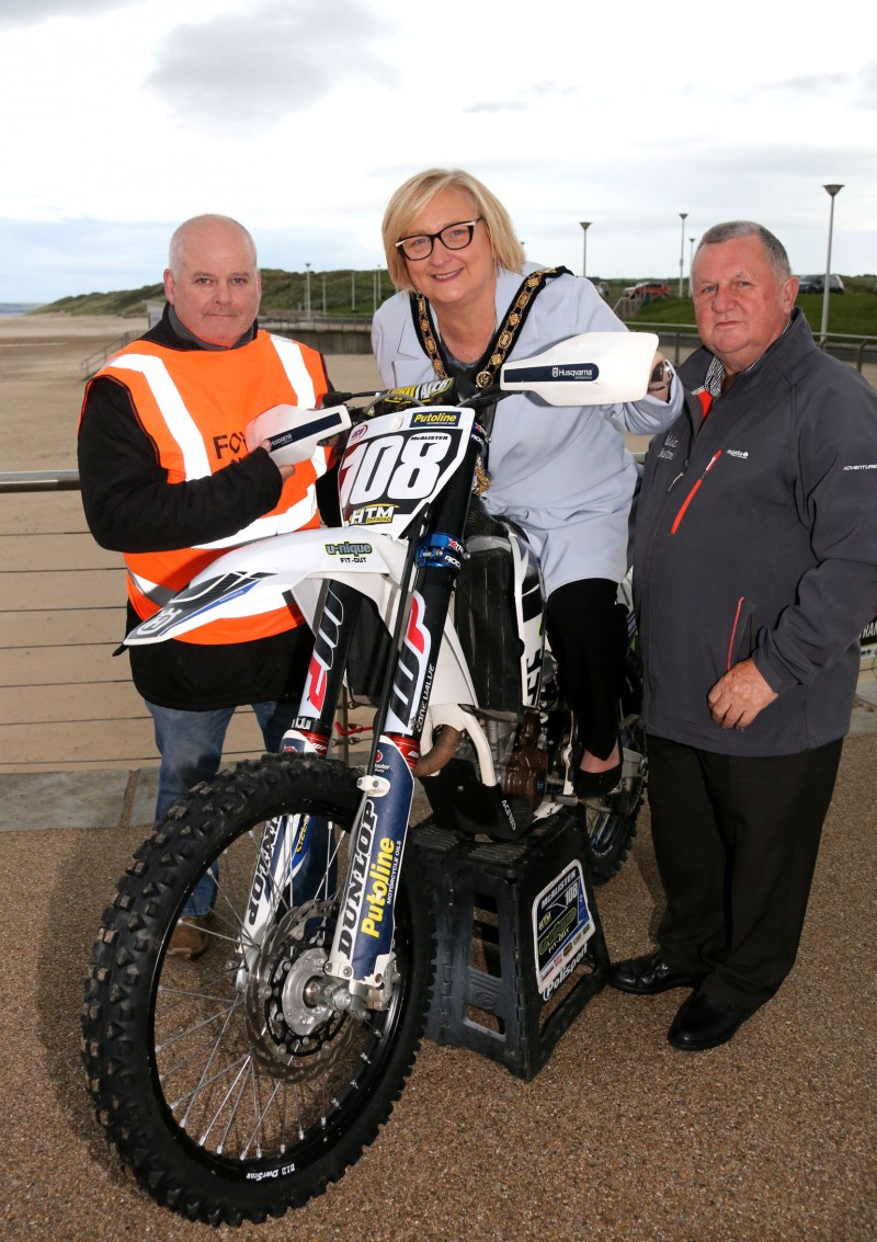 The Mayor of Causeway Coast and Glens Borough Council Councillor Brenda Chivers joins Peter Bell, Foyle District Motor Cycle Club Secretary and Clerk of the Course Eddie Johnston at East Strand ahead of Portrush Beach Races which will take place on October 27th and 28th promising two days of exciting entertainment.
