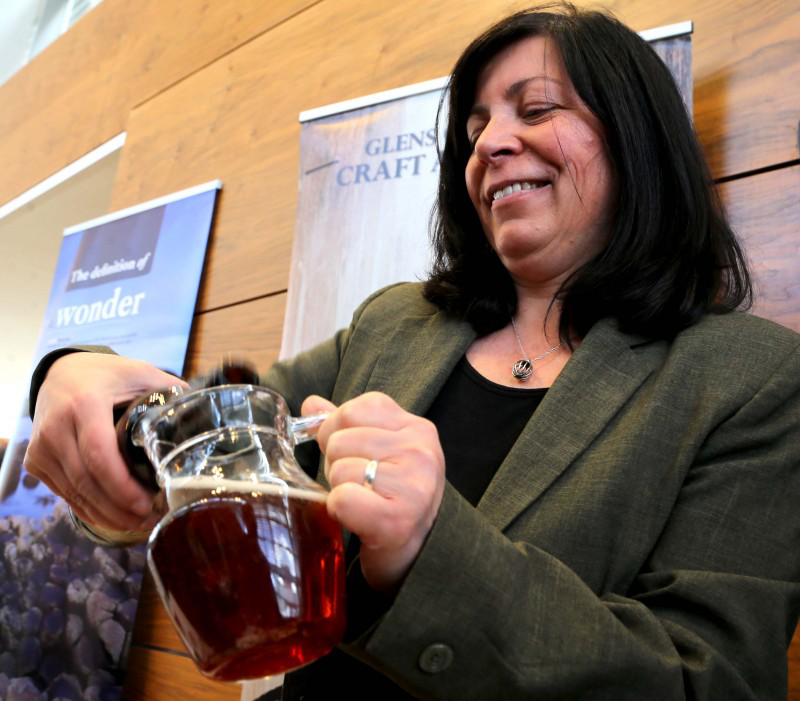 Isabella McCarry from Glen of Antrim Craft Ale and Beers pours a drink at the Taste of the Causeway Coast and Glens celebration event.