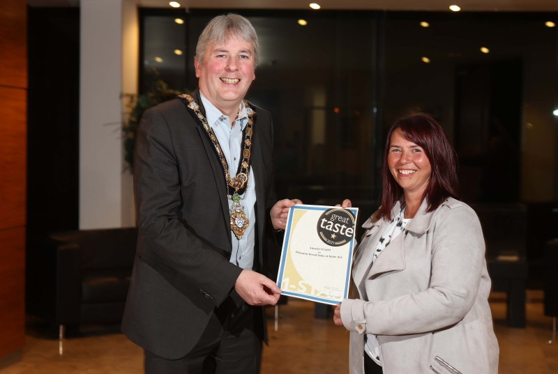 The Mayor of Causeway Coast and Glens Borough Council Councillor Richard Holmes pictured with Great Taste Award winner Lynne Gardiner from Amazin Grazin.