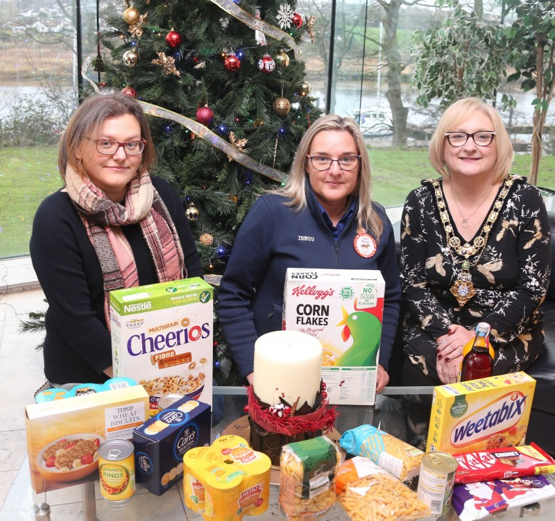 The Mayor of Causeway Coast and Glens Borough Council, Councillor Brenda Chivers pictured with Melanie Gibson and Wendy Holmes from Coleraine Foodbank receiving the food donated by Causeway Coast and Glens Borough Council’s November ‘Food Drive.’