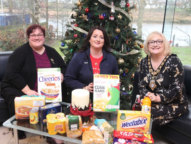 The Mayor of Causeway Coast and Glens Borough Council, Councillor Brenda Chivers pictured with Hazel Brooks and Mags Connolly from Limavady Foodbank receiving the food donated by Causeway Coast and Glens Borough Council’s November ‘Food Drive.’