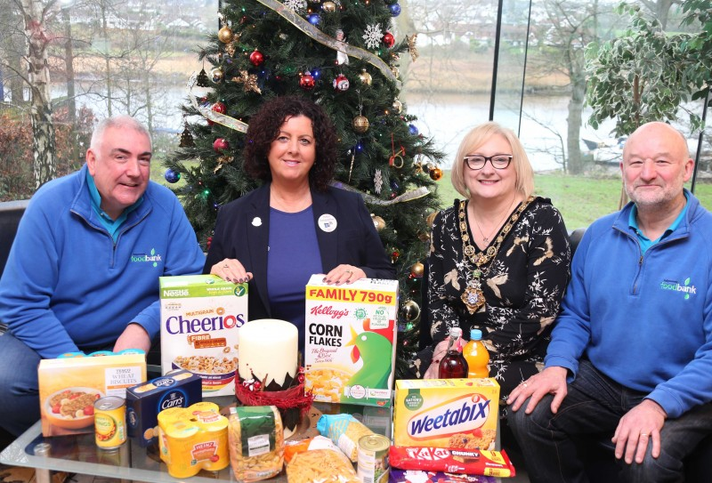 The Mayor of Causeway Coast and Glens Borough Council, Councillor Brenda Chivers pictured with Jarleth Hegarty, Jacqueline Brogan and Peter Rollins from Ballymoney Foodbank receiving the food donated by Causeway Coast and Glens Borough Council’s November ‘Food Drive.’