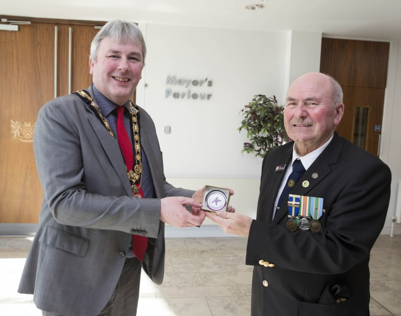 The Mayor of Causeway Coast and Glens Borough Council Councillor Richard Holmes receives a fuchsia emblem from Chairman Jim McEneany during a visit by members of the Organisation of National Ex-Service Personnel to Cloonavin. The Fuchsia Appeal is run annually to raise funds to provide accommodation and other assistance to ex-service personnel in need. The Fuchsia is the organisation’s fundraising emblem, a badge of remembrance and a symbol to honour those currently serving in the Defence Forces.