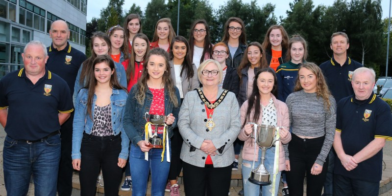 Members of the Minor Antrim Camogie team, including Captain Ellen Hynds, pictured with mentors and the Mayor of Causeway Coast and Glens Borough Council Councillor Brenda Chivers at a reception held in their honour.