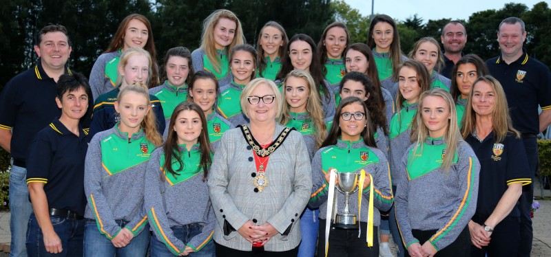 Members of the Under 16 Antrim Camogie team, including Captain Beth McAuley, pictured with mentors and the Mayor of Causeway Coast and Glens Borough Council Councillor Brenda Chivers at a reception held in their honour.