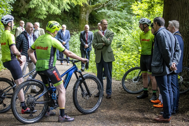 Members of Carn Wheelers Cycle Club give the Duke of Edinburgh a demonstration at Garvagh Forest