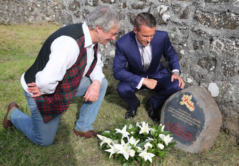 Hector McDonnell pictured with the Chief Executive of Causeway Coast and Glens Borough Council David Jackson at the newly unveiled commemorative stone in the grounds of St Cuthbert's Church where the bodies of those recovered from the Girona are buried in an unmarked grave.