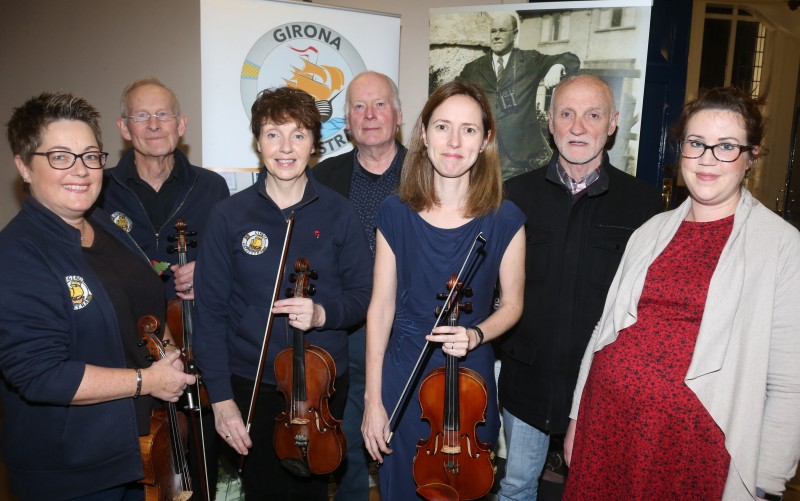 Causeway Coast and Glens Borough Council’s Museum Services Officer Sarah Carson (right), George Murphy (second right) and compere Len Graham (back row, centre) pictured with members of the Girona Community Orchestra who performed at a musical celebration inspired by Sam Henry.