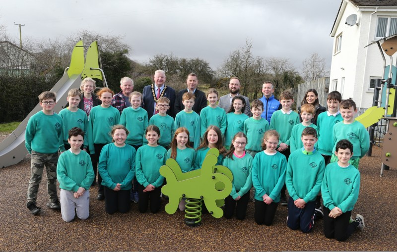 Mayor of Causeway Coast and Glens Councillor Steven Callaghan, joins children from St Patrick’s and St Joseph’s PS Garvagh, as the newly transformed Glenullin playpark is unveiled. Pictured from (l-r back row) Pat Mulvenna, Council’s Director of Leisure & Development; Councillor Ciarán Archibald; Mayor Cllr. Steven Callaghan;  Michael O'Brien, Council’s Sport & Community Facilities Manager; Lindsay Hutchinson, Council’s Estates Technical Officer; Garry Cardwell, Council Funding Support Officer and primary 7 teacher Eimear McKaigue.