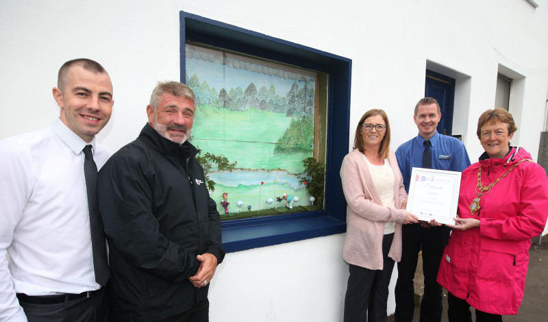 Bryan Brown from William Hill bookmakers pictured with Eddie Rowan, Tourism NI Events Manager, Annette Deighan from Causeway Chamber of Commerce, and the Mayor of Causeway Coast and Glens Borough Council Councillor Joan Baird OBE  as Cathal McTaggart receives the second place prize in the window dressing competition.