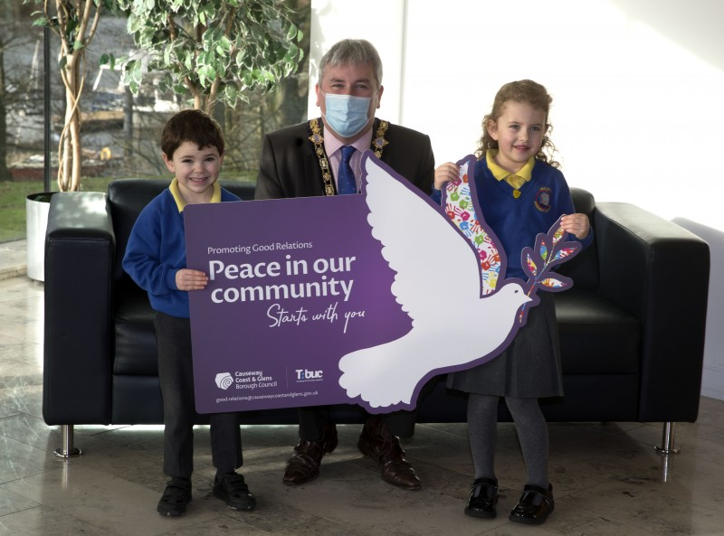 Hezlett Primary School pupils Noah MacBruithin and Lily Lindsay pictured with the Mayor, Councillor Richard Holmes, at the special reception for young people who took part in Causeway Coast and Glens Borough Council’s Good Relations Week competition.