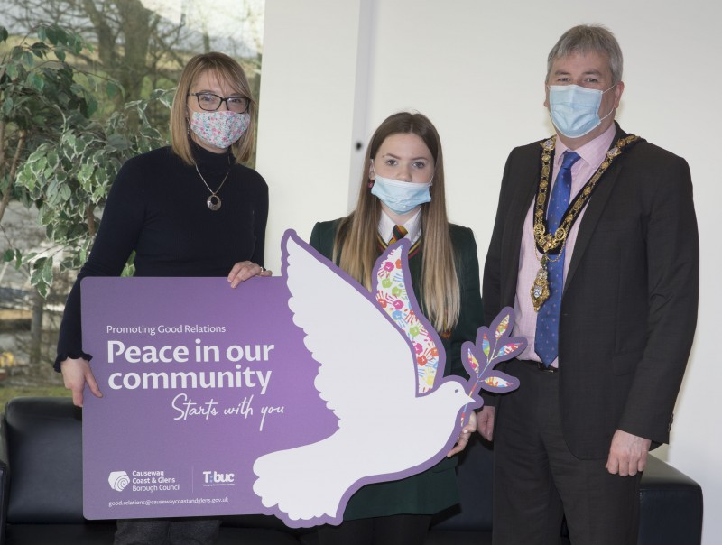 Joining the Mayor of Causeway Coast and Glens Borough Council, Councillor Richard Holmes, at the reception for young people who took part in a Good Relations Week competition are Ann-Marie Donaghy, a teacher at St Mary’s Limavady and pupil Maya Donaghy.